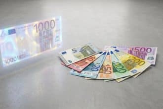 A glowing, semi-transparent 1000 euro note next to a fan of crisp 5, 10, 20, 50, 100, 200, 500 euro notes.